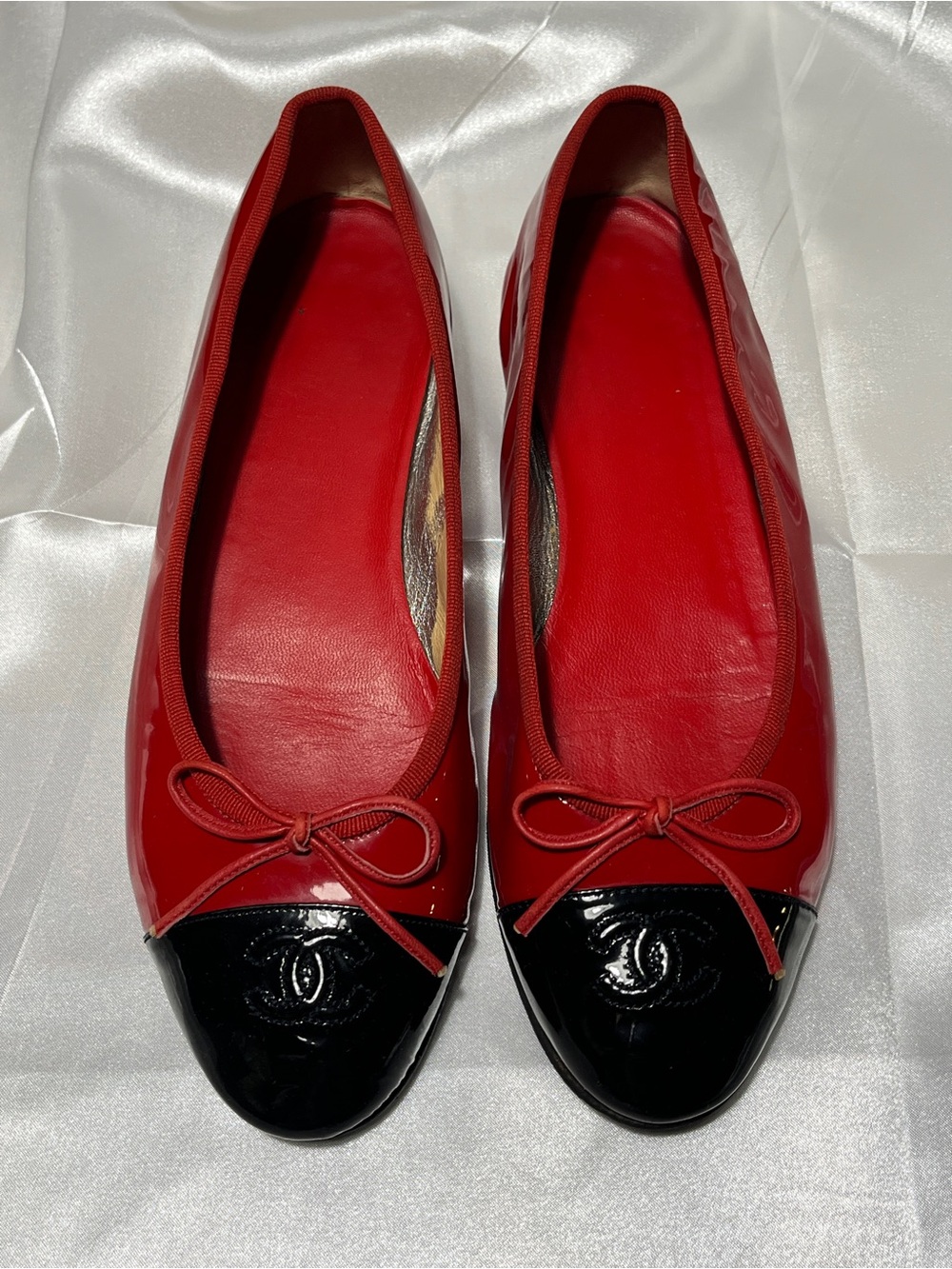 CHANEL Red Leather Ballet Flats with Black Patent Cap Toe